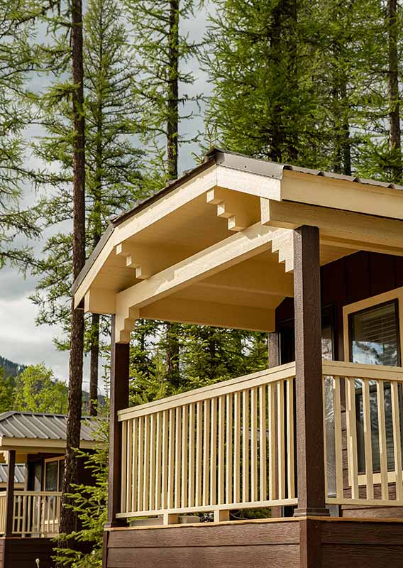 afternoon light on front porches of West Glacier Cabins