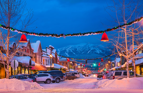 Village decorated for the holidays with mountain view in the background