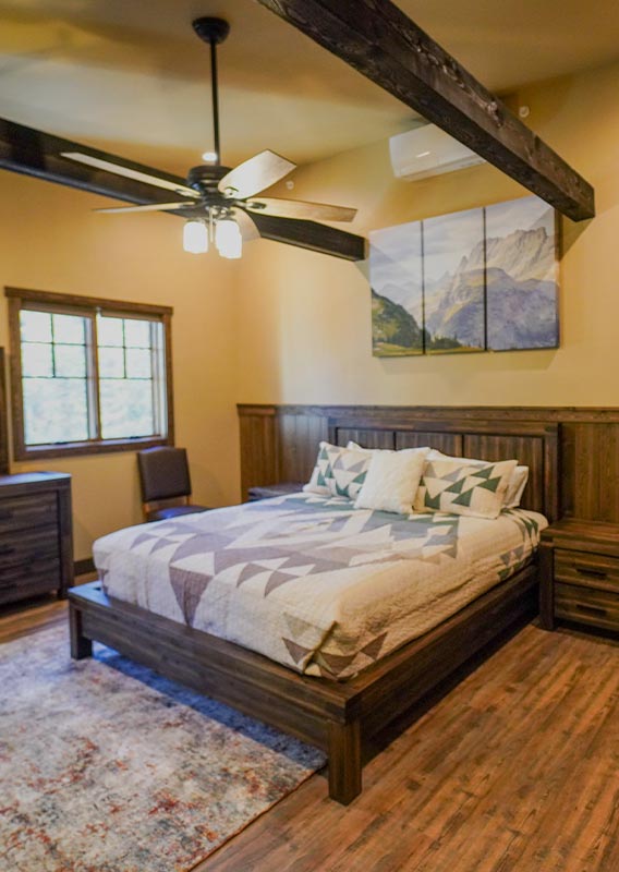 A hotel bedroom with a fireplace and sitting area.