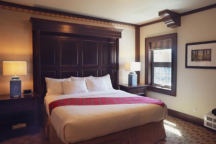 A large bed in a hotel suite.